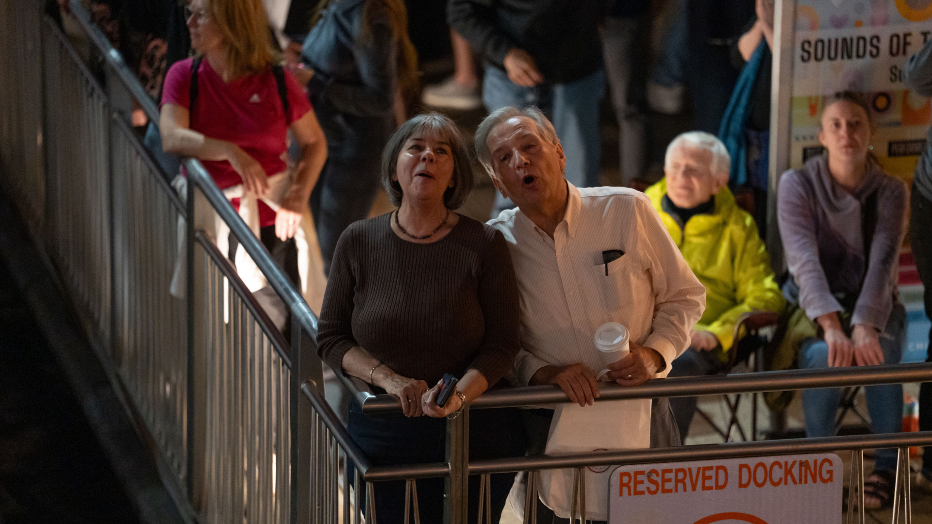 Two people singing on the Riverwalk